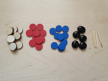 tokens + pebbles + sticks for working with the mat construction of the expression model